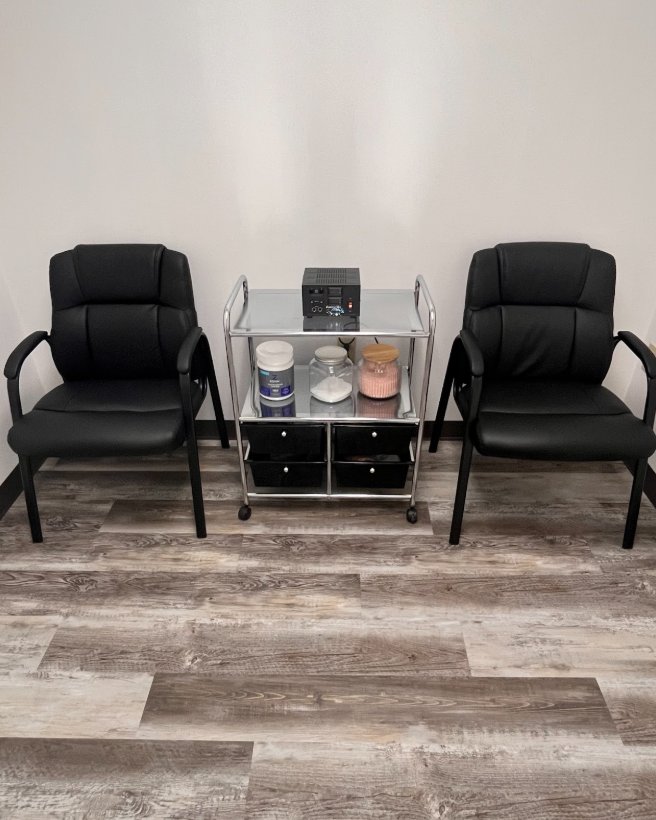 The foot detox station with two chairs and an ionic foot bath unit