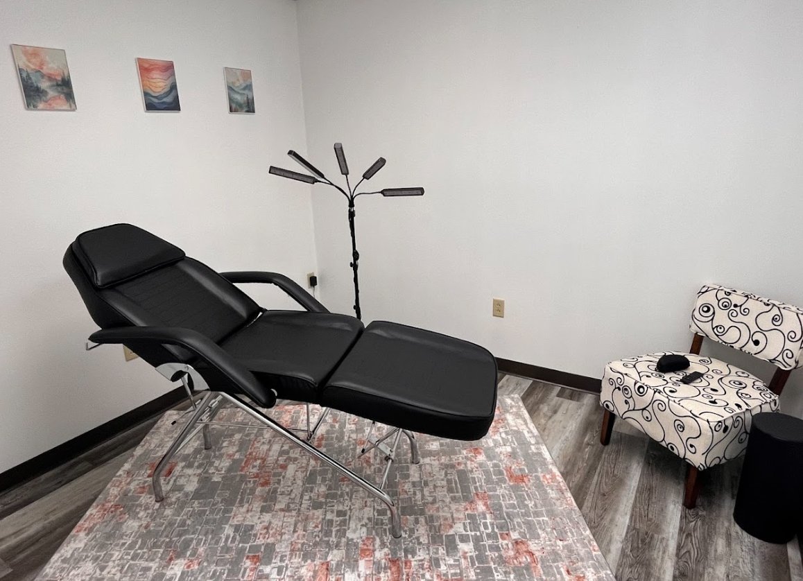 The light therapy room with a reclining chair and LED light array